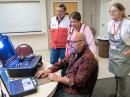 Jason Eaton, KJ6HNP, responded to a Red Cross request for assistance at the Grass Valley shelter. He demonstrated Amateur Radio’s messaging capabilities to shelter managers Tess and Pete Santiago and shelter volunteer Judy Arbuckle (right). The radio amateurs handled health-and-welfare and other message requests.